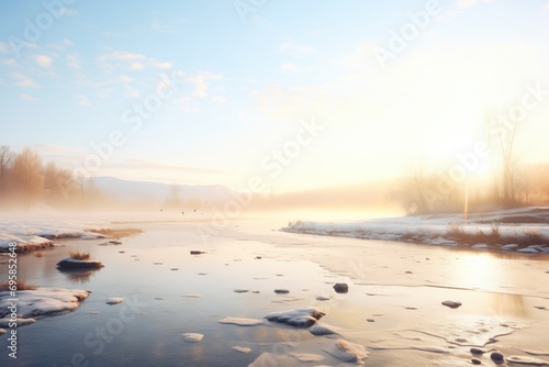 sunrise over a misty  partially frozen river