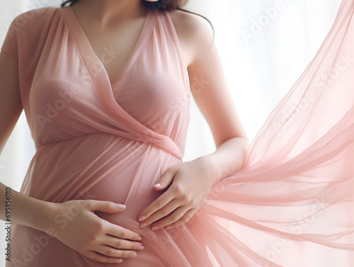 Closeup of pretty young pregnant woman with pregnancy belly