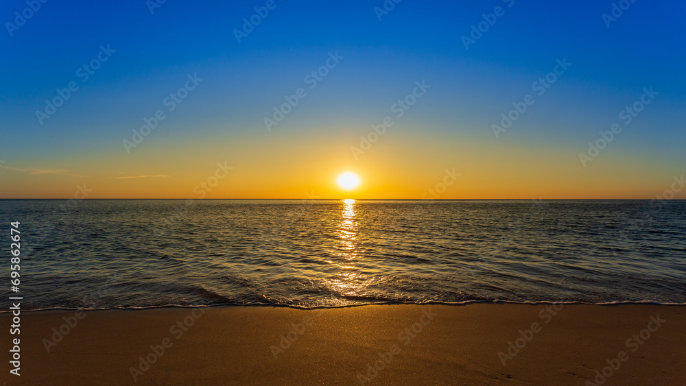 Beautiful sunset on the beach and sea - Holiday Vacation concept