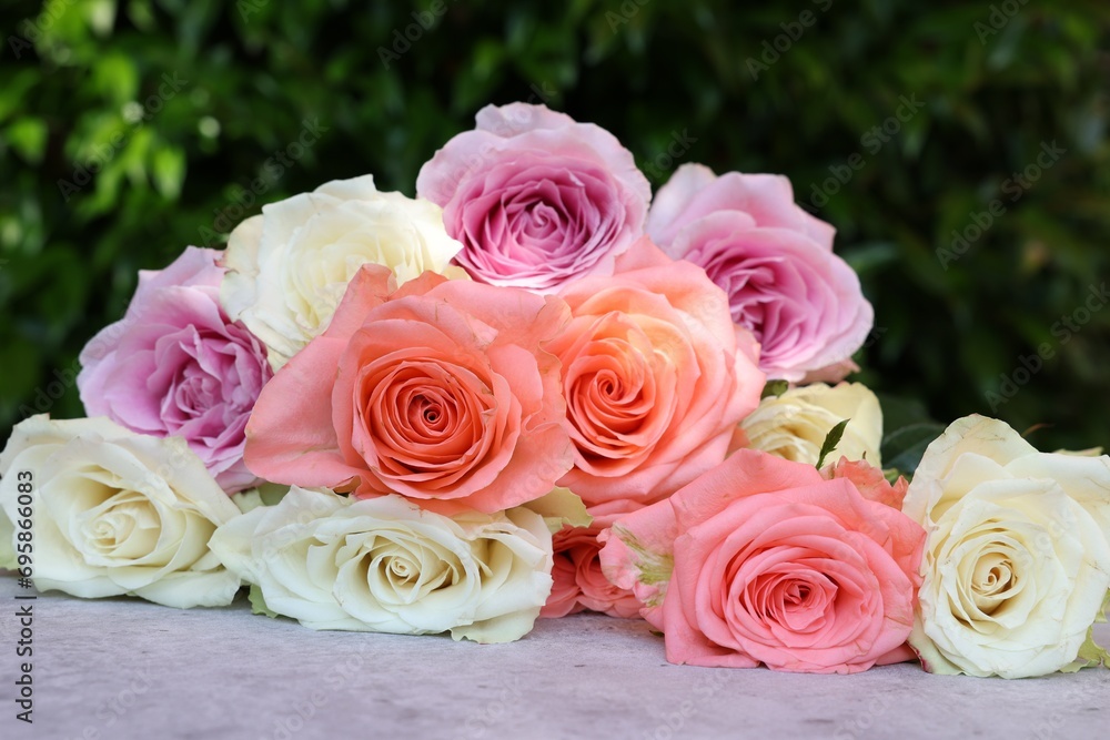 Beautiful bouquet of roses on light grey table outdoors, closeup Beautiful bouquet of roses on light grey table outdoors, closeup