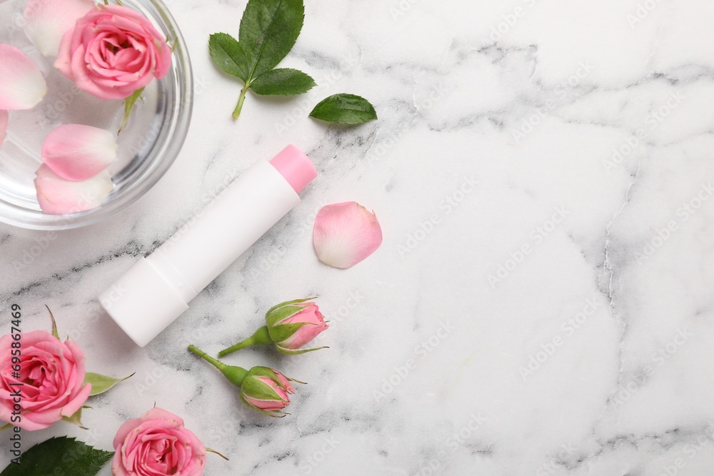 Flat lay composition with lip balm on white marble background, space for text Flat lay composition with lip balm on white marble background, space for text
