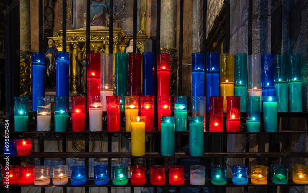 Obraz premium Multicolored burning church candles