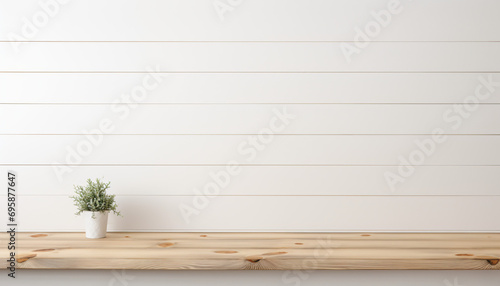 Empty wooden white table over white wall background 