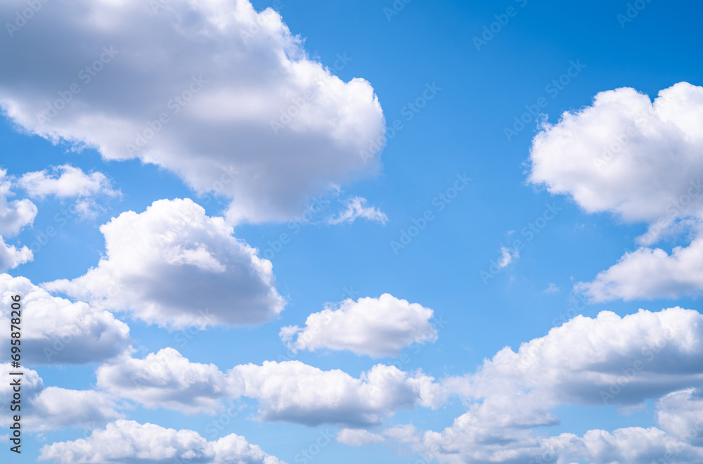 Beautiful blue sky and white cumulus clouds abstract background. Cloudscape background. Blue sky and fluffy white clouds on sunny days. Blue sky and daylight. World Ozone Day. Ozone layer. Summer sky. Beautiful blue sky and white cumulus clouds abstract background. Cloudscape background. Blue sky and fluffy white clouds on sunny days. Blue sky and daylight. World Ozone Day. Ozone layer. Summer sky.