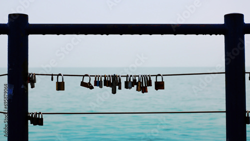 Padlocks on a fence over the lake Balaton in Siofok, Hungary photo
