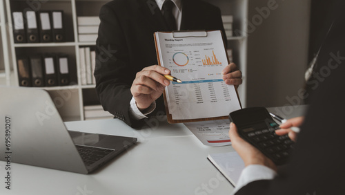 Group of businessmen working together to calculate income, They are revising the financial numbers, Take out financial documents and check them with a calculator,