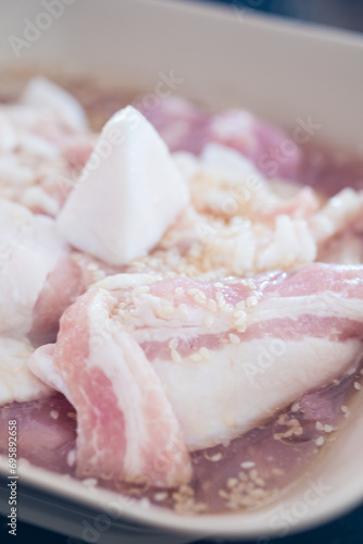 Streaky pork and bacon marinade sprinkle with white sesame for buffet hot pan, Moo Ka Ta