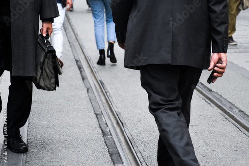 Office Managers and Business People Commute to Work in the Morning or from Office on Foot. Successful Businessmen Walking.