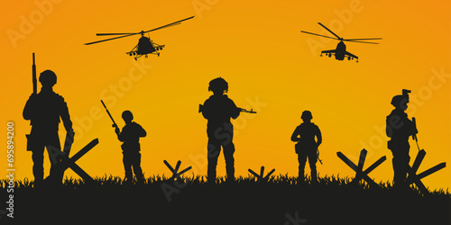The military is moving forward. Silhouette of soldiers with weapons at the end of the battle.