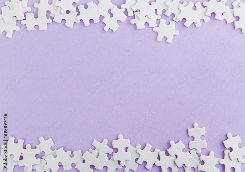 Pieces of jigsaw puzzle on purple background Pieces of jigsaw puzzle on purple background