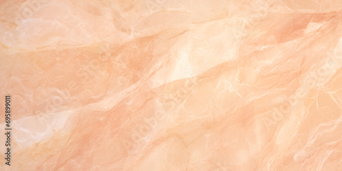 A close up view of a marble wall. Monochrome peach fuzz background.
