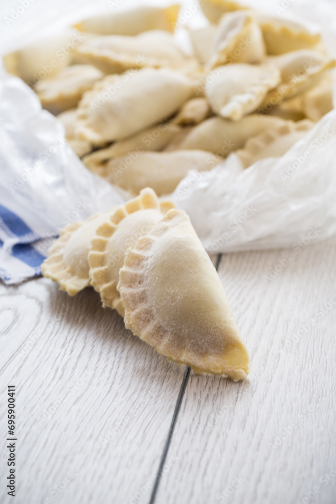 Raw dumplings with filling inside, Ukrainian cuisine.