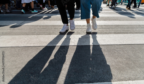 Shadows of people on the crosswalk © xy