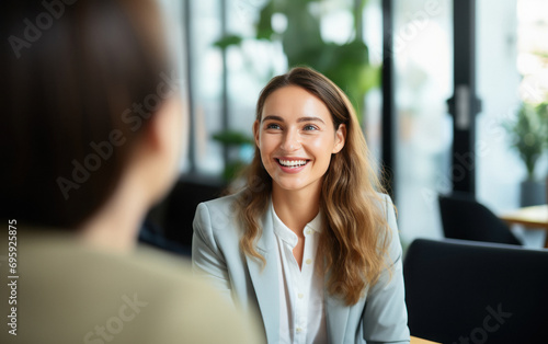 smiling businesswoman or corporate employee in the meeting.