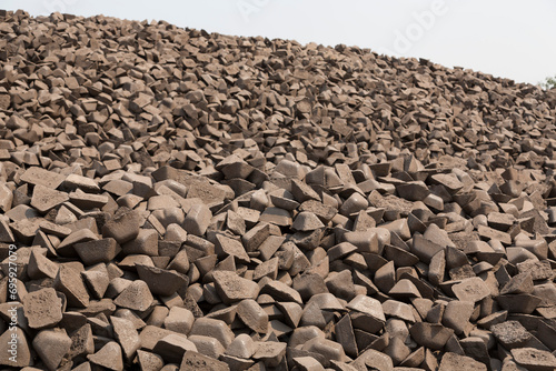 Pig iron , is an intermediate good used by the iron industry in the production of steel, which is developed by smelting iron ore in a blast furnace. Pig iron has a high carbon 3.5-4.5%