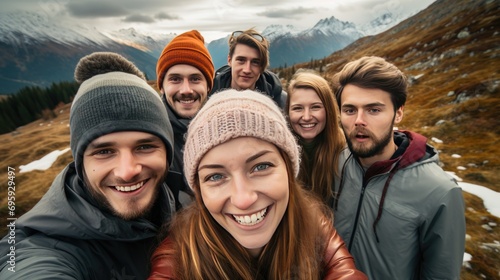selfie of group of diverse young people friends hiking in the mountains © Barosanu