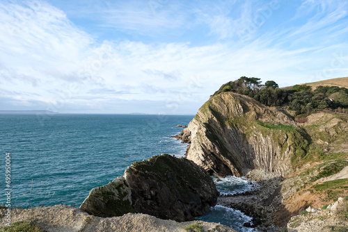 Lulworth Cove cliffs view on a way to Durdle Door. The Jurassic Coast is World Heritage Site on the English Channel coast of southern England. Dorset, UK. Jurassic coast view in Dorset, UK. Stair Hole