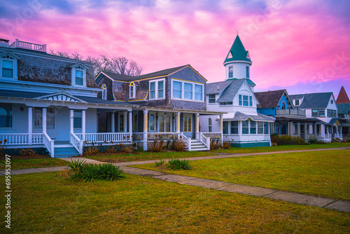 Oak Bluffs sunset skyline with well-preserved landmark houses and dramatic pink winter cloudscape over Ocean Park on the island of Martha's Vineyard in Dukes County, Massachusetts, United States photo
