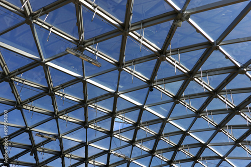 Modern panoramic glass roof with many metal cell sections