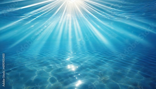 abstract blue water background with sunbeams