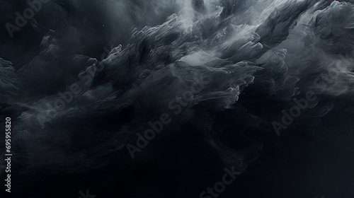 Abstract background formed by swirling acrylic black colors in water.