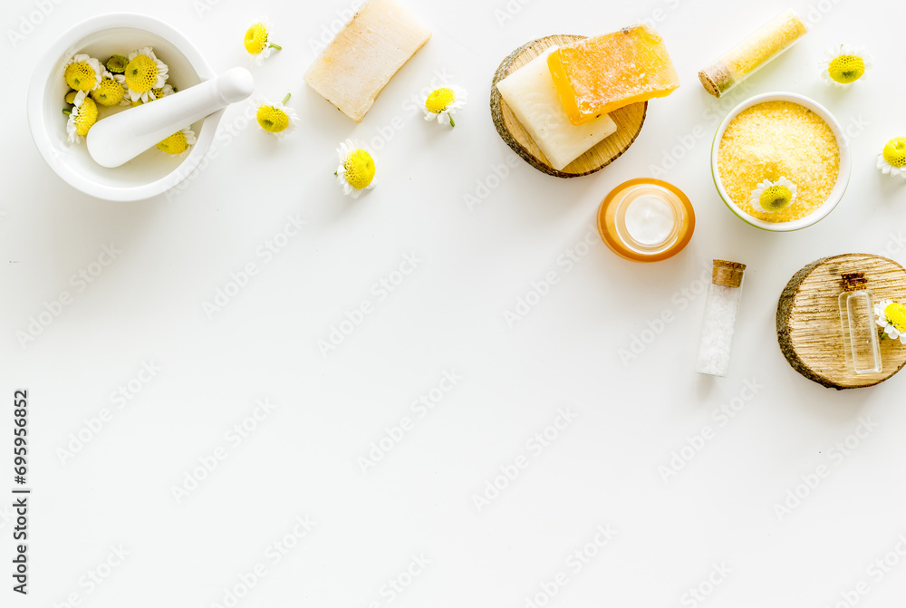 Pharmacy chamomile flowers with herbal cosmetic beauty products