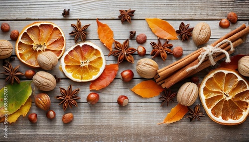 autumn background with candied oranges nuts and spices