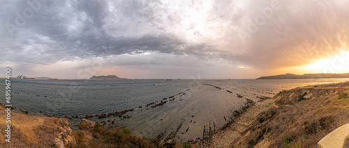 Getares beach in Algeciras is flanked by flysch formations, Strait of Gibraltar Natural Park, Algeciras, Spain photo