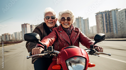 A elderly couple smiling on a motorbike. 