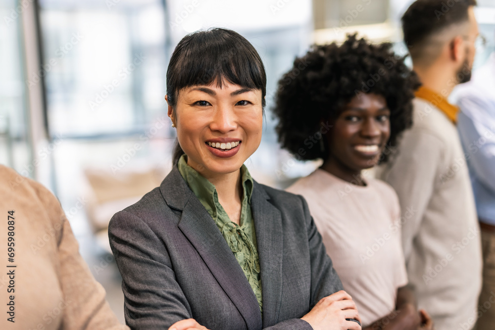 Young Asian business woman standing in the office. Portrait Young Asian business woman standing in the office. Portrait