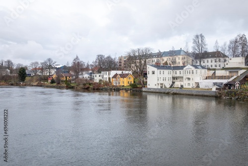 Walking along the Nidelven's bank in Trondheim on a winter day, Trøndelag, Norway