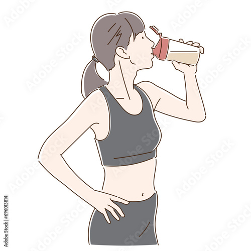 トレーニング中、水分補給する女性