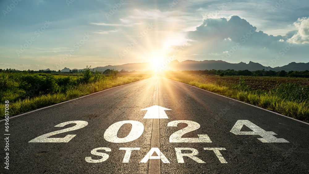 New year 2024 or start straight concept.word 2024 written on the road in the middle of asphalt road at sunset.Concept of planning and challenge or career path,business strategy,opportunity and change - obrazy, fototapety, plakaty 