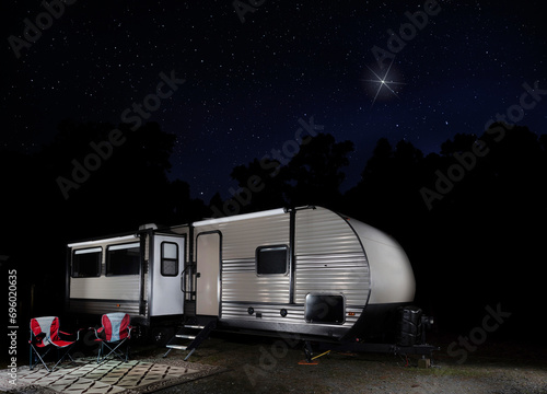 Star shining brightly over a camper trailer