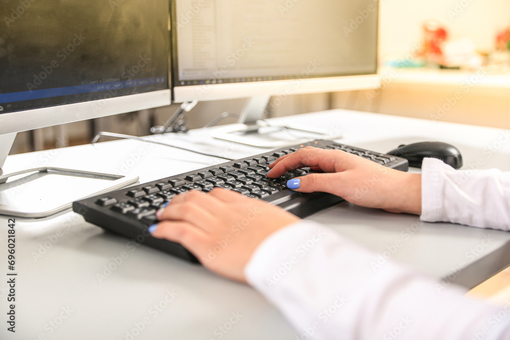 girl working at office on keyboard girl working at office on keyboard