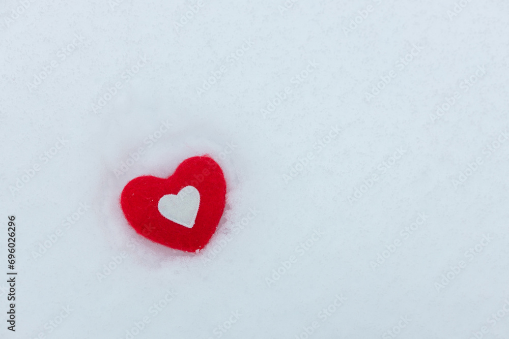 valentines day greeting card, cozy heart on white snow, free space for text