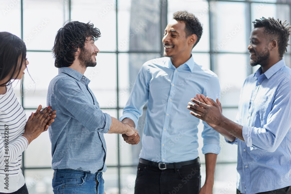 Successful Business Collaboration: Executives Greet with Handshake in Office Successful Business Collaboration: Executives Greet with Handshake in Office