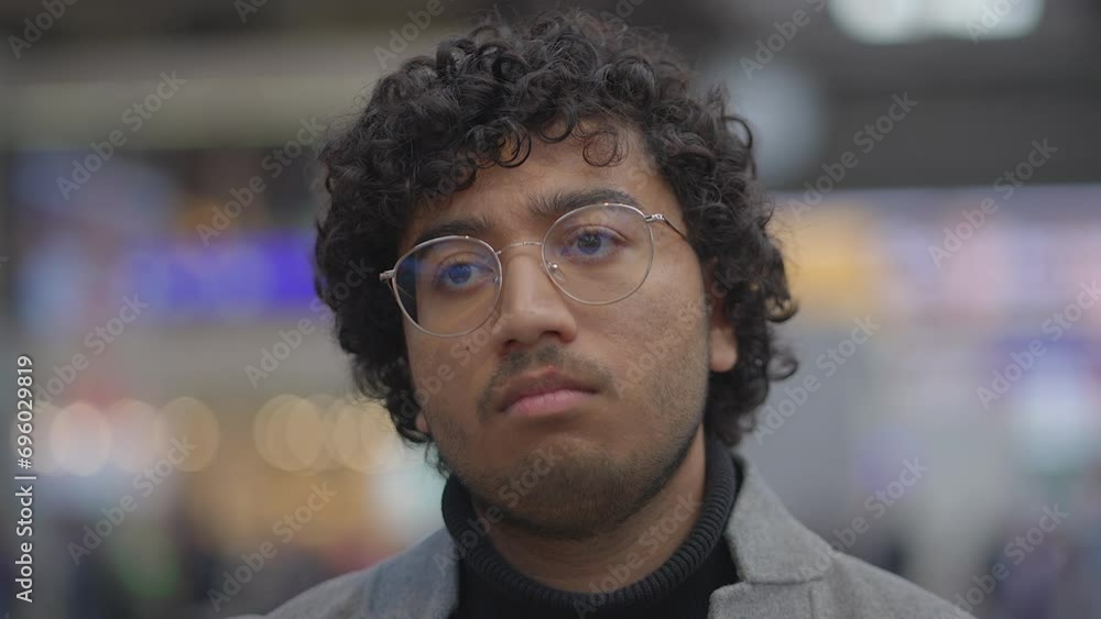 Headshot Of Indian Man With Glasses Commuting In Train Station Headshot Of Indian Man With Glasses Commuting In Train Station