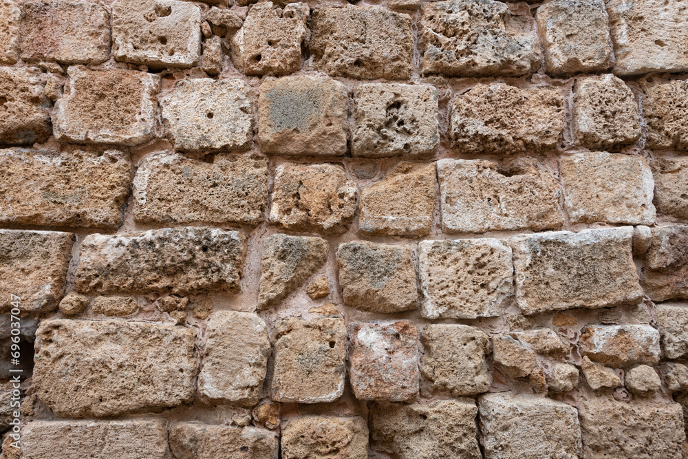 Detail of a section of an old stone wall buttress exterior of the fortress in Acre, Israel Detail of a section of an old stone wall buttress exterior of the fortress in Acre, Israel