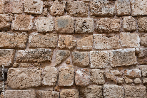 Detail of a section of an old stone wall buttress exterior of the fortress in Acre, Israel
