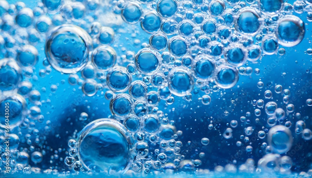 pure effervescent vitality cosmetic refreshing hygiene or hydrogen blue energy studio shot of carbonated blue gas bubbles under water in full frame macro close up with selective focus blur