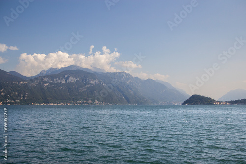 View of a glimpse of Lake Como from the lakefront promenade, morning. early autumn. Lake Como, Italy