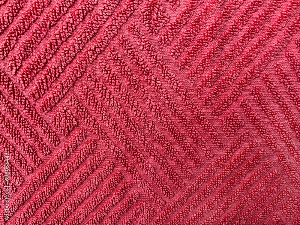 Close up of red cloth fluffy faric in zigzag pattern. Beautiful pattern texture background. Red fabric cloth background texture.