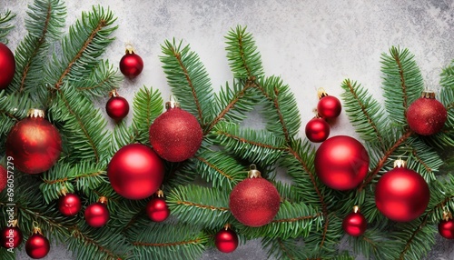 christmas tree branches with red balls in on background border