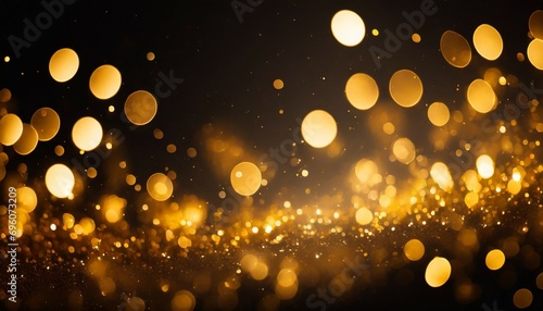golden abstract bokeh on black background holiday concept
