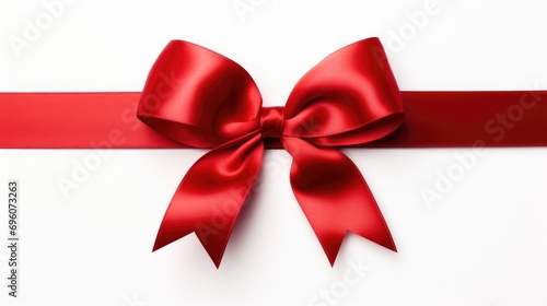 vibrant red ribbon with a bow gracefully tied on a pristine white background.