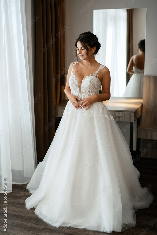Fototapeta premium bride in a white dress at the training camp