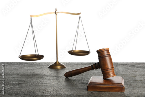 Law concept. Judge's mallet and scales of justice on dark grey table against white background