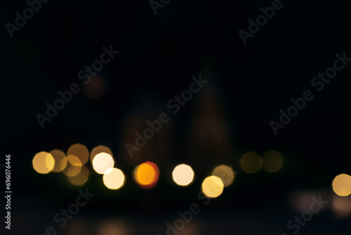 Festive bokeh lights on black background. Christmas concept © Viktoriya