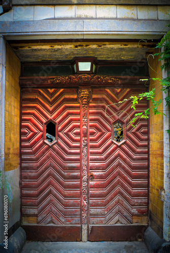 Old weathered, grunge, spooky and damaged wooden house entrance door